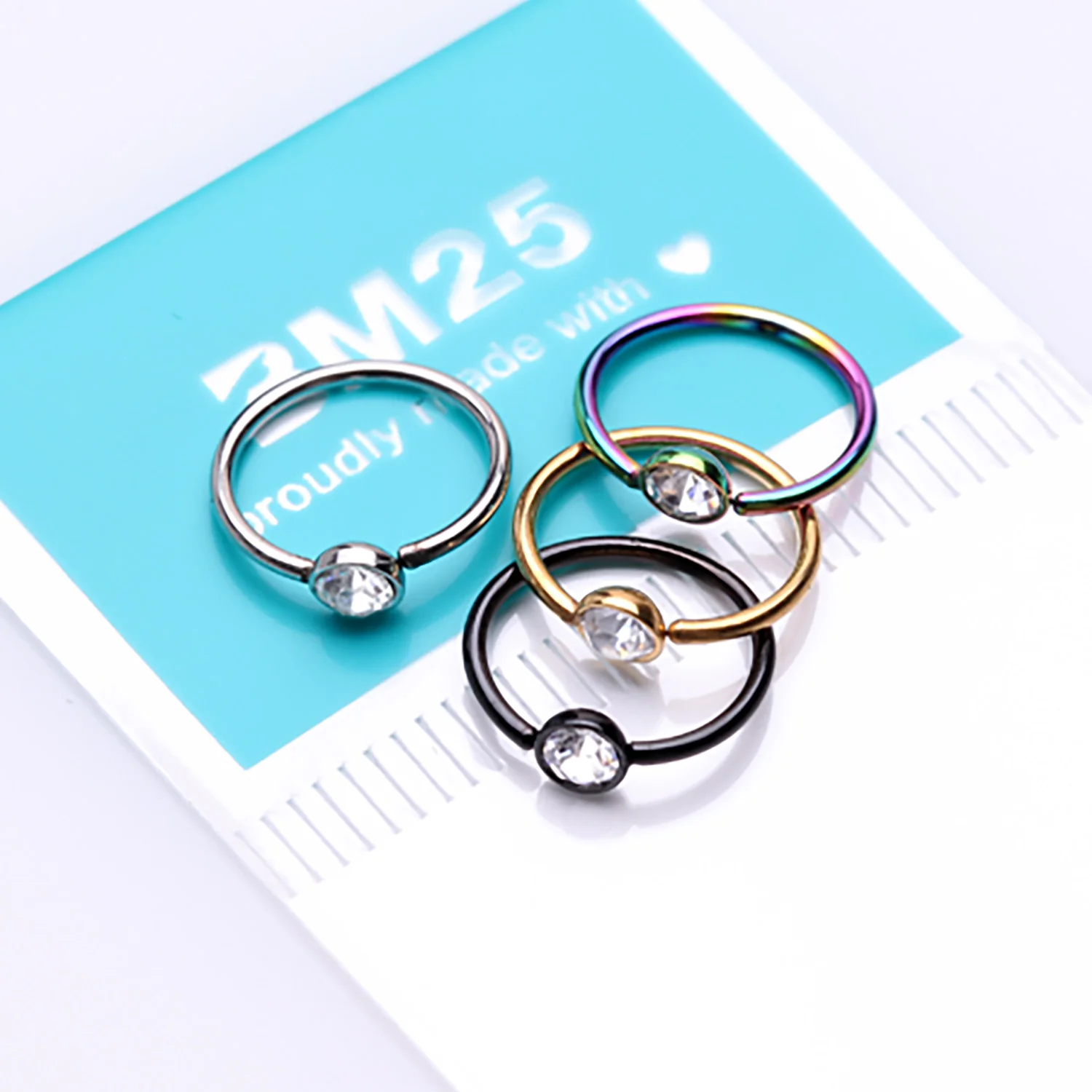 4 Pcs of Assorted Color Plated Press-Fit Gem Bendable Hoop Ring Package - Image 2