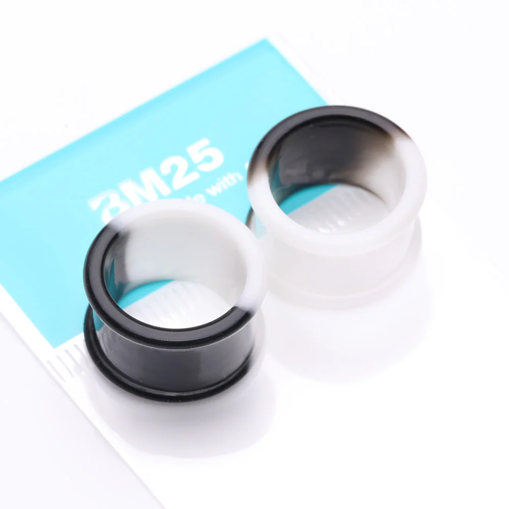 A Pair of Black and White Duo Tone Flexible Silicone Double Flared Tunnel Plug - Image 4