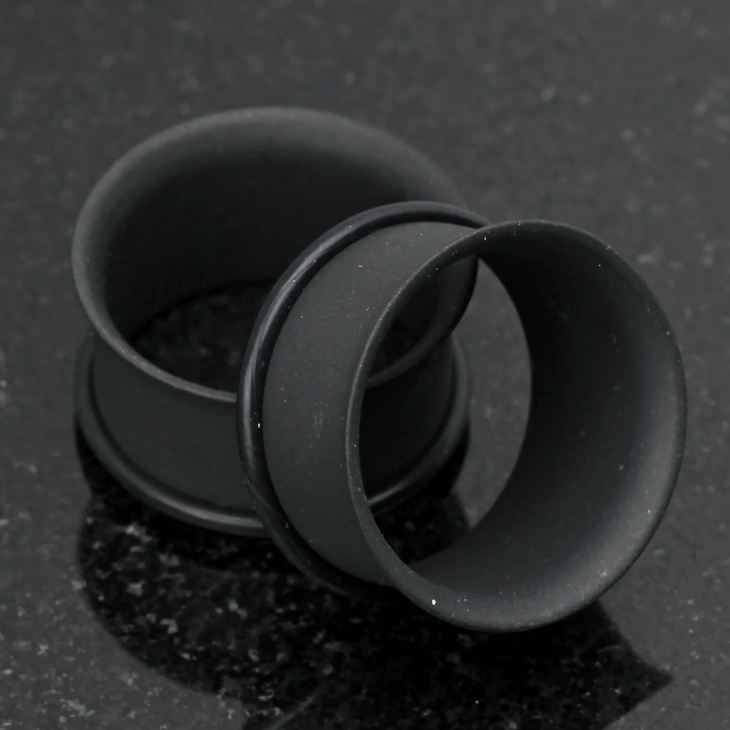 A Pair of Matte Black Steel Single Flared Ear Gauge Tunnel Plug - Image 2