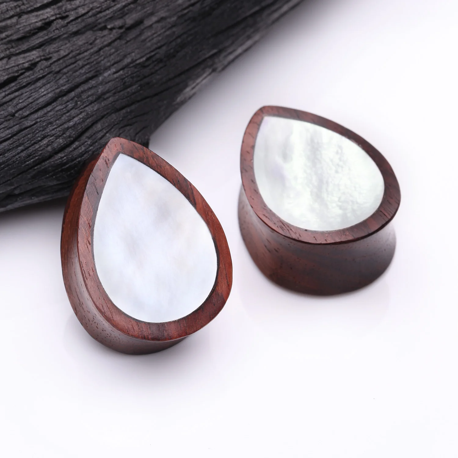 A Pair of Rosewood Bali Mother of Pearl Inlay Teardrop Double Flared Plug - Image 2
